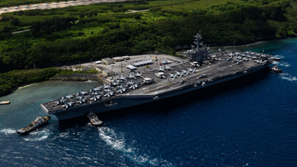  the aircraft carrier uss theodore roosevelt (cvn 71) departs naval base guam after a regularly scheduled port call.  (u.s. navy photo)