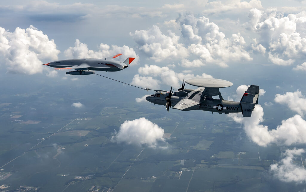An MQ-25 Stingray unmanned aerial vehicle refuels an E-2D Advanced Hawkeye aircraft over MidAmerica Airport in Mascoutah, Ill,, Aug. 18, 2021. 