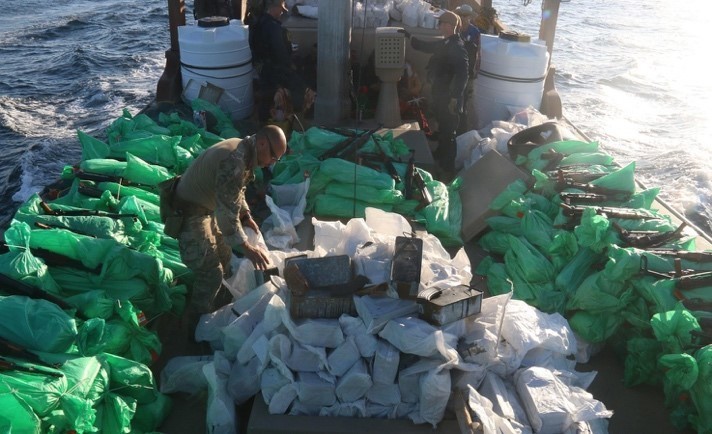 U.S. service members from patrol coastal ship USS Typhoon (PC 5) inventory an illicit shipment of weapons while aboard a stateless fishing vessel transiting international waters in the North Arabian Sea, Dec. 20. (U.S. Navy photo)